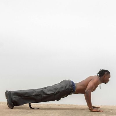 Man in a plank position, demonstrating core strength and stability.